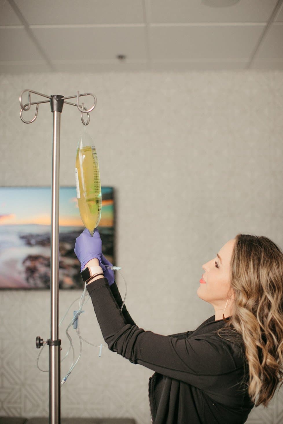 IV nurse administering treatment — Revitalize Mobile IV